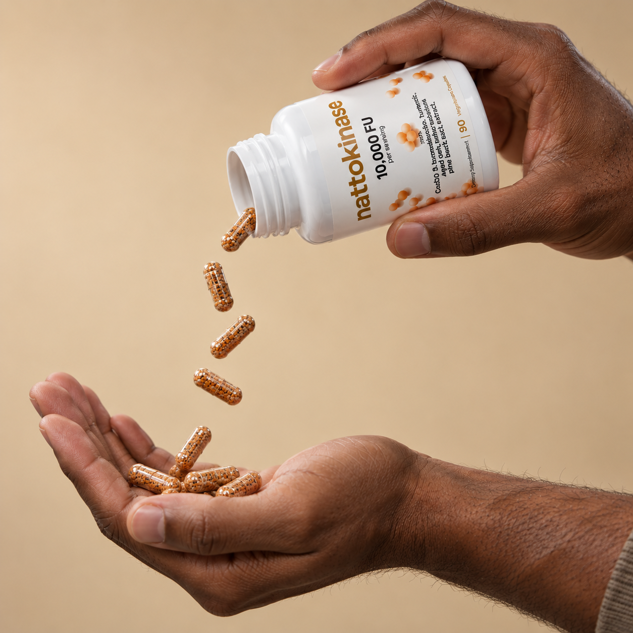 Londira Nattokinase 10,000 FU capsules being poured from the bottle into an open hand